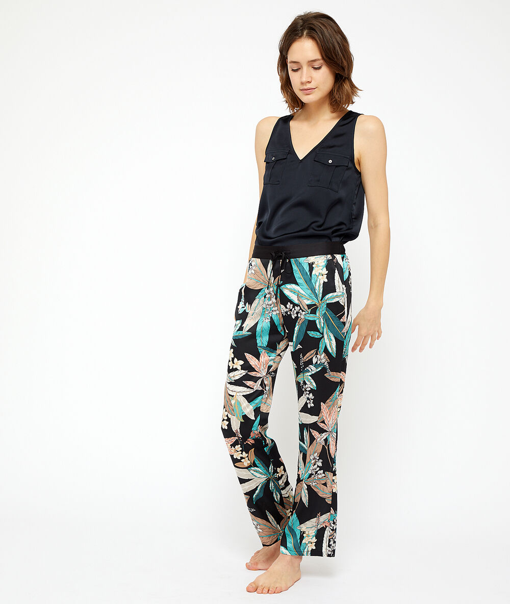 Hose mit blätter-print schwarz.