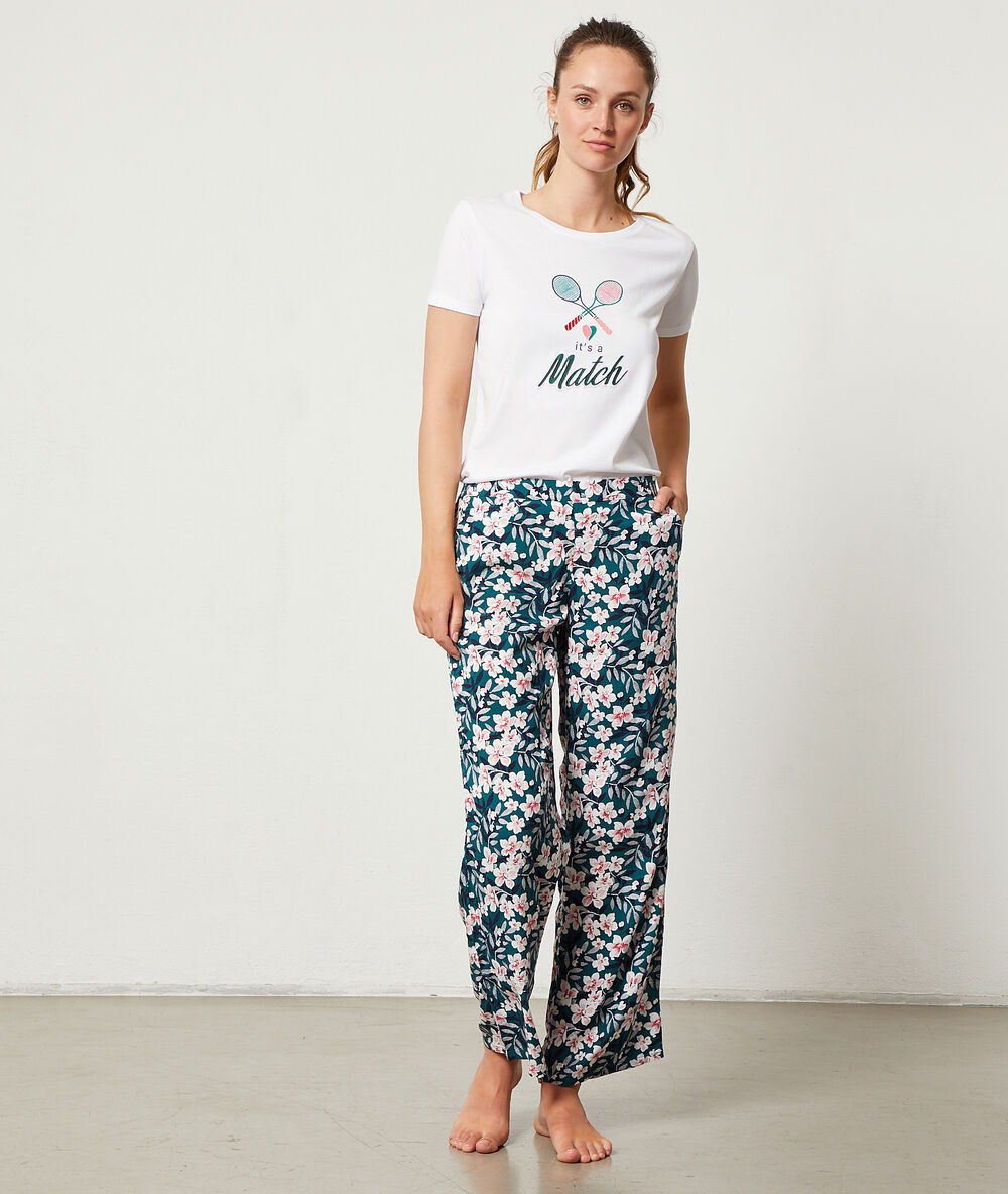 Pantalon imprimé floral vert.