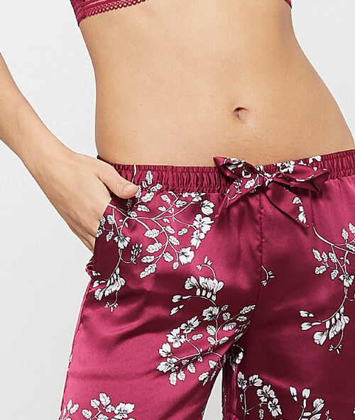 Pantalon satin imprimé fleuri bordeaux.