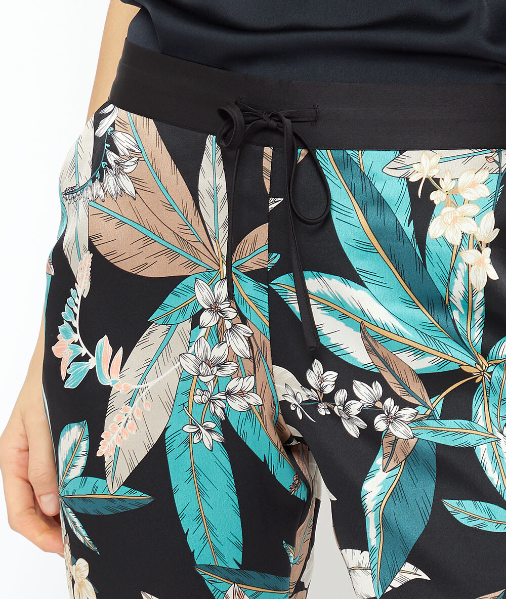 Hose mit blätter-print schwarz.
