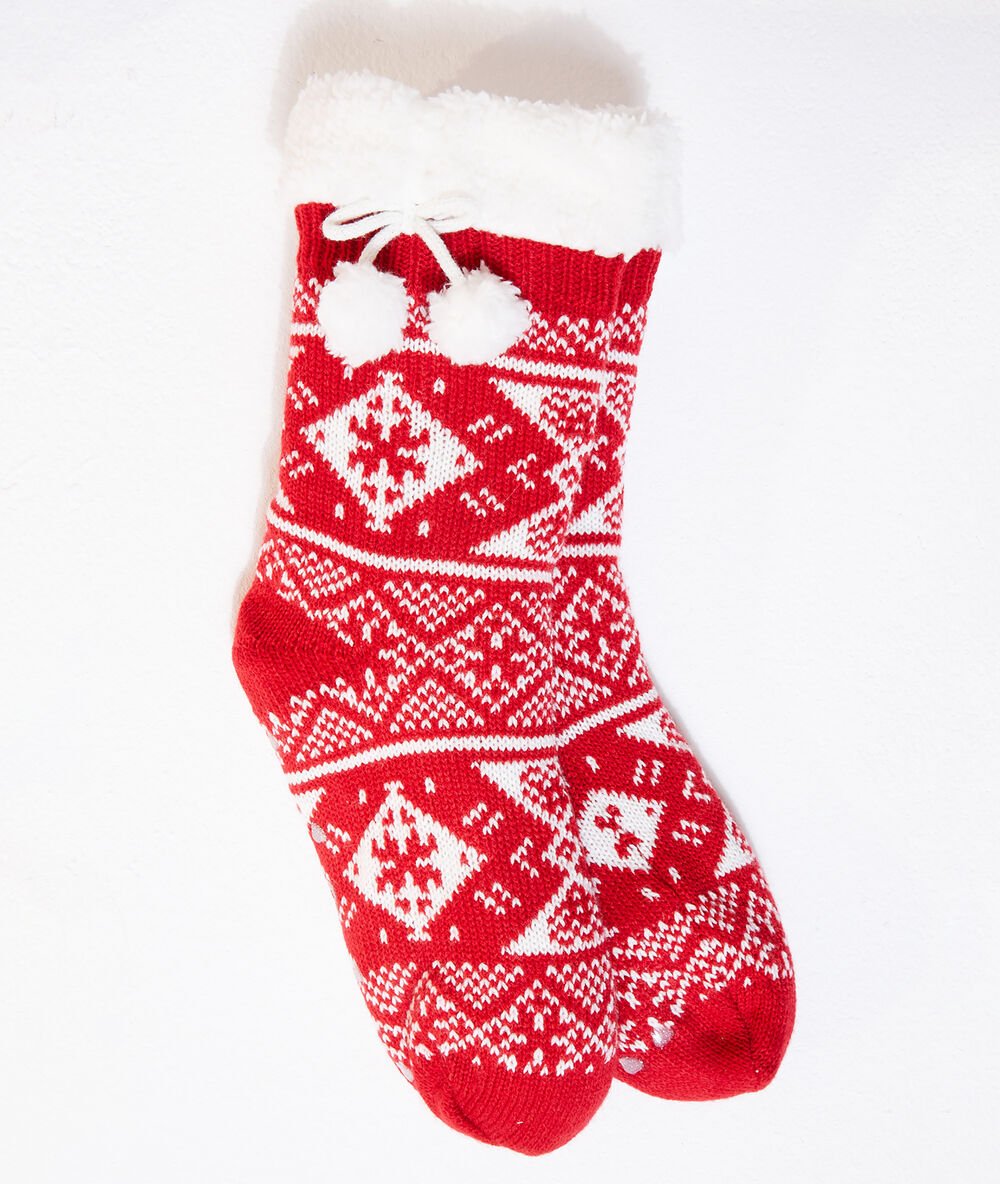 Chaussettes à pompons rouge.