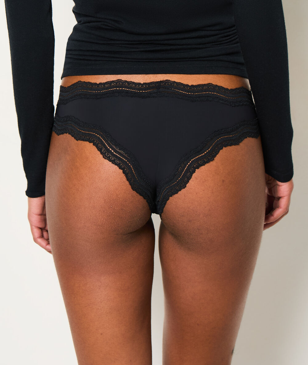 Tanga bords dentelle graphique noir.