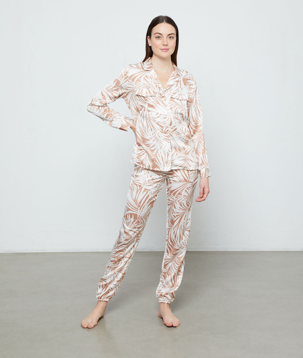 Hose mit blätter-print beige.