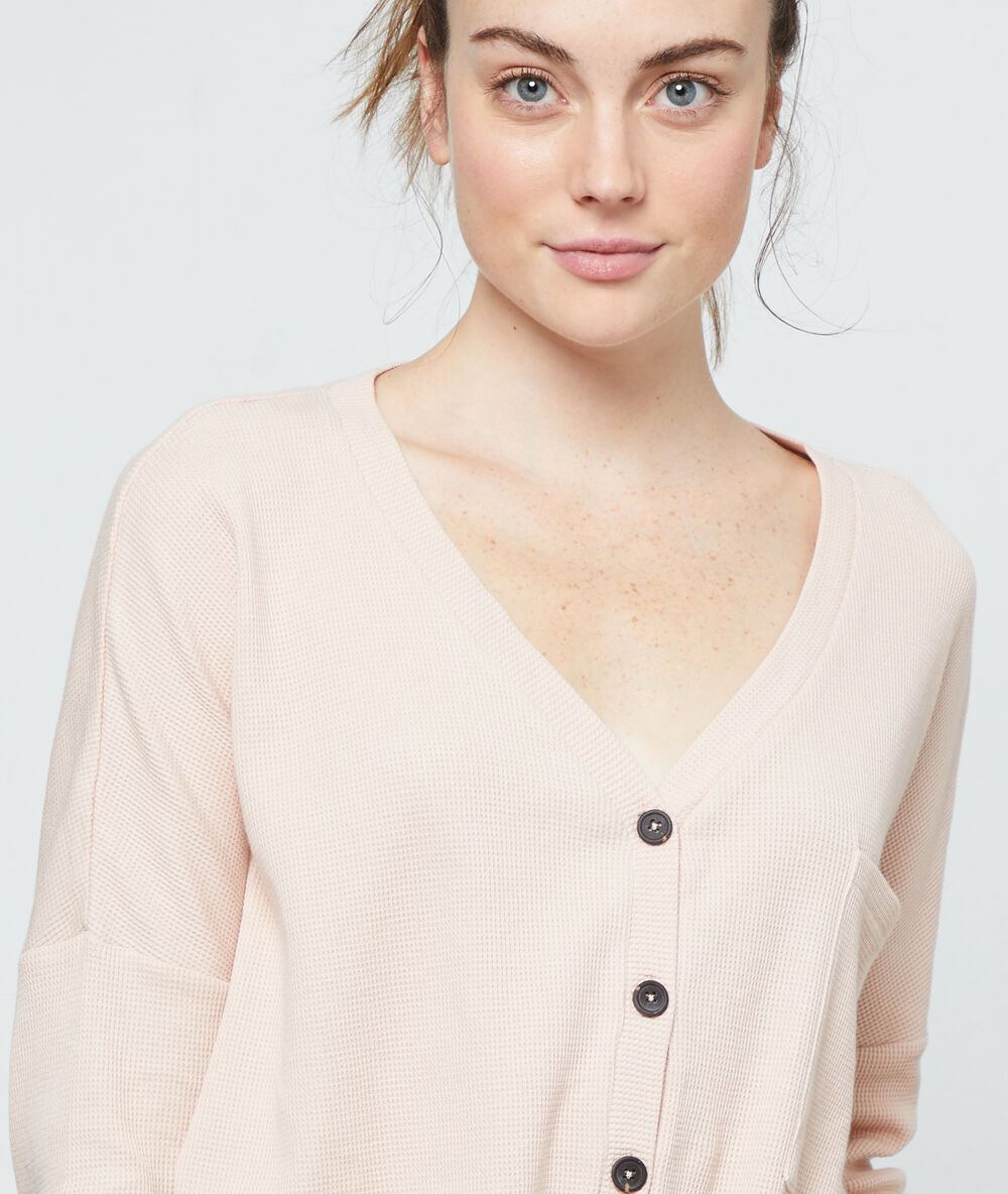 Top manches longues en coton rose.